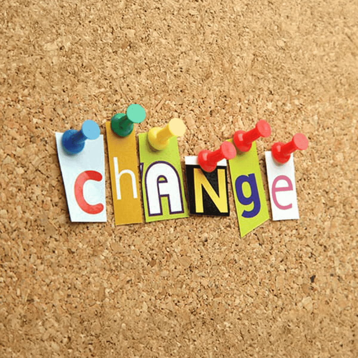 cork board with the word change pinned