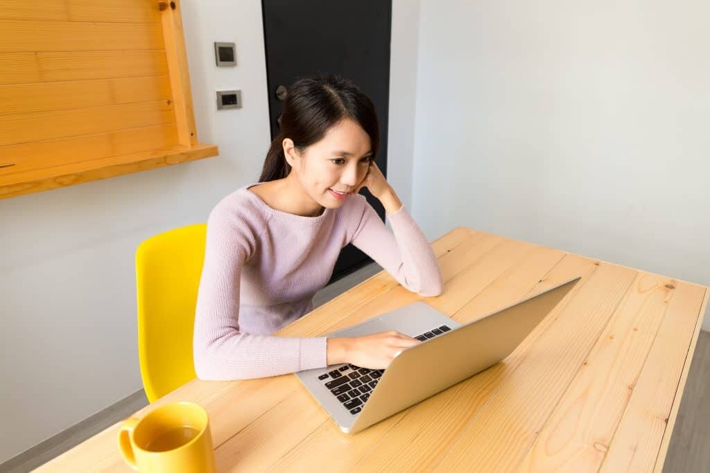 Young Woman Use Of The Laptop Computer
