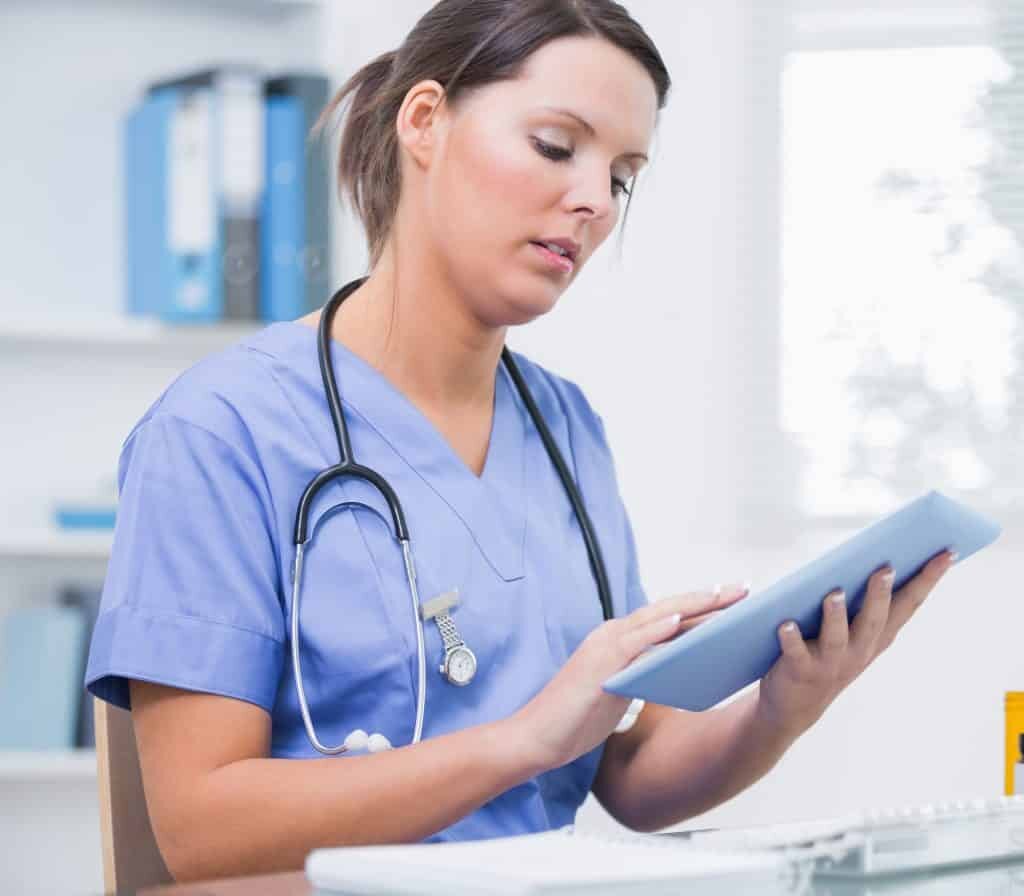 medical professional with tablet