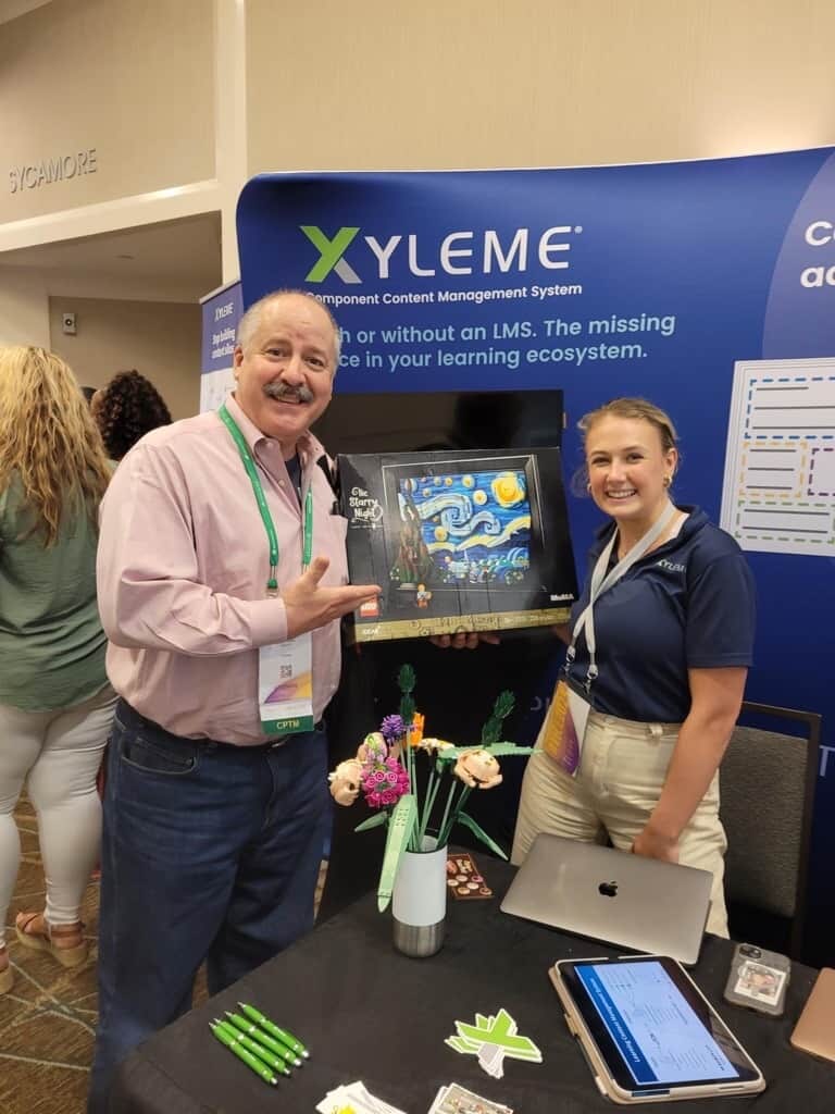 Booth photo with staff member and attendee