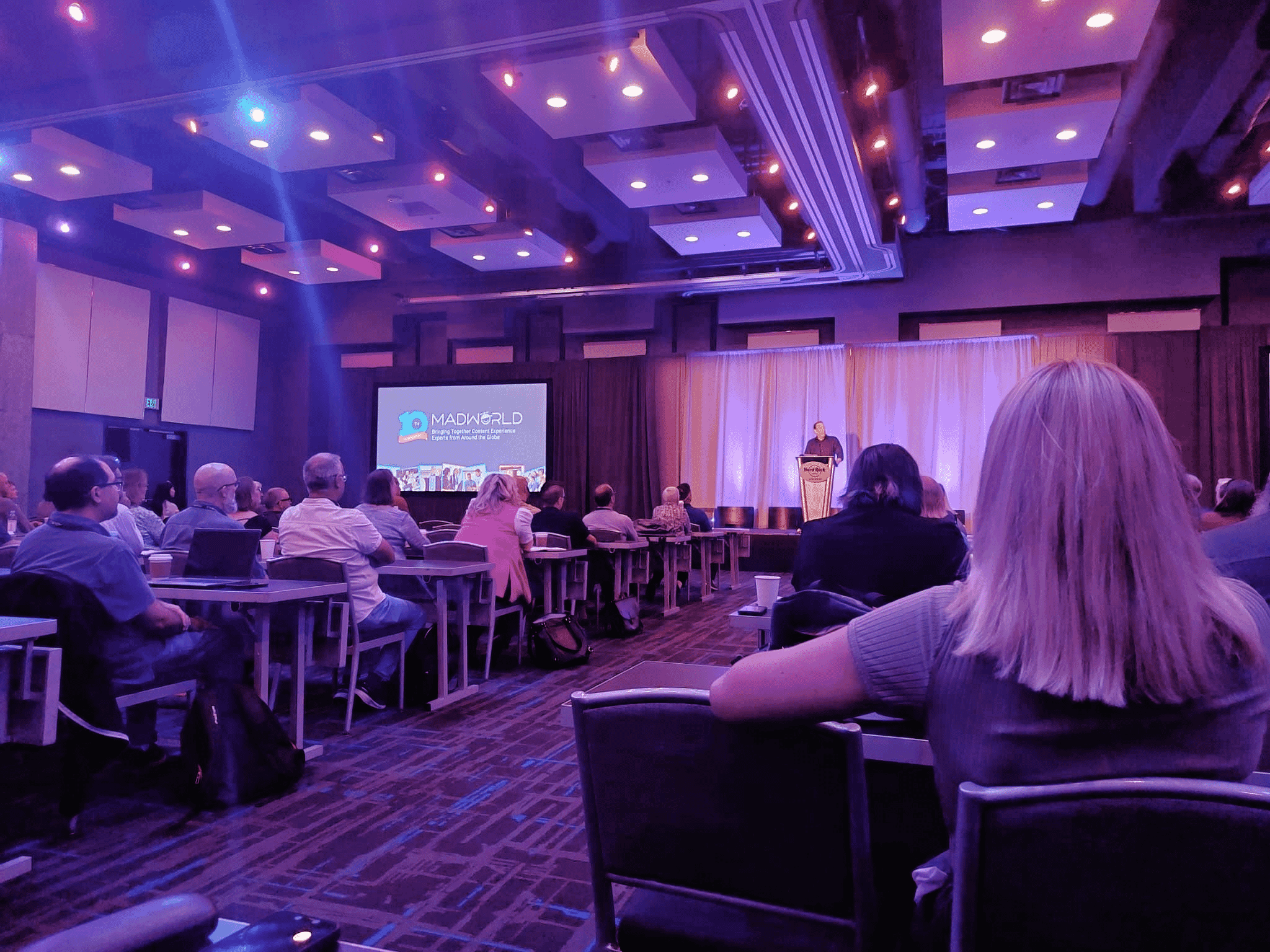 Conference room at MadWorld with Anthony Oliver speaking on stage