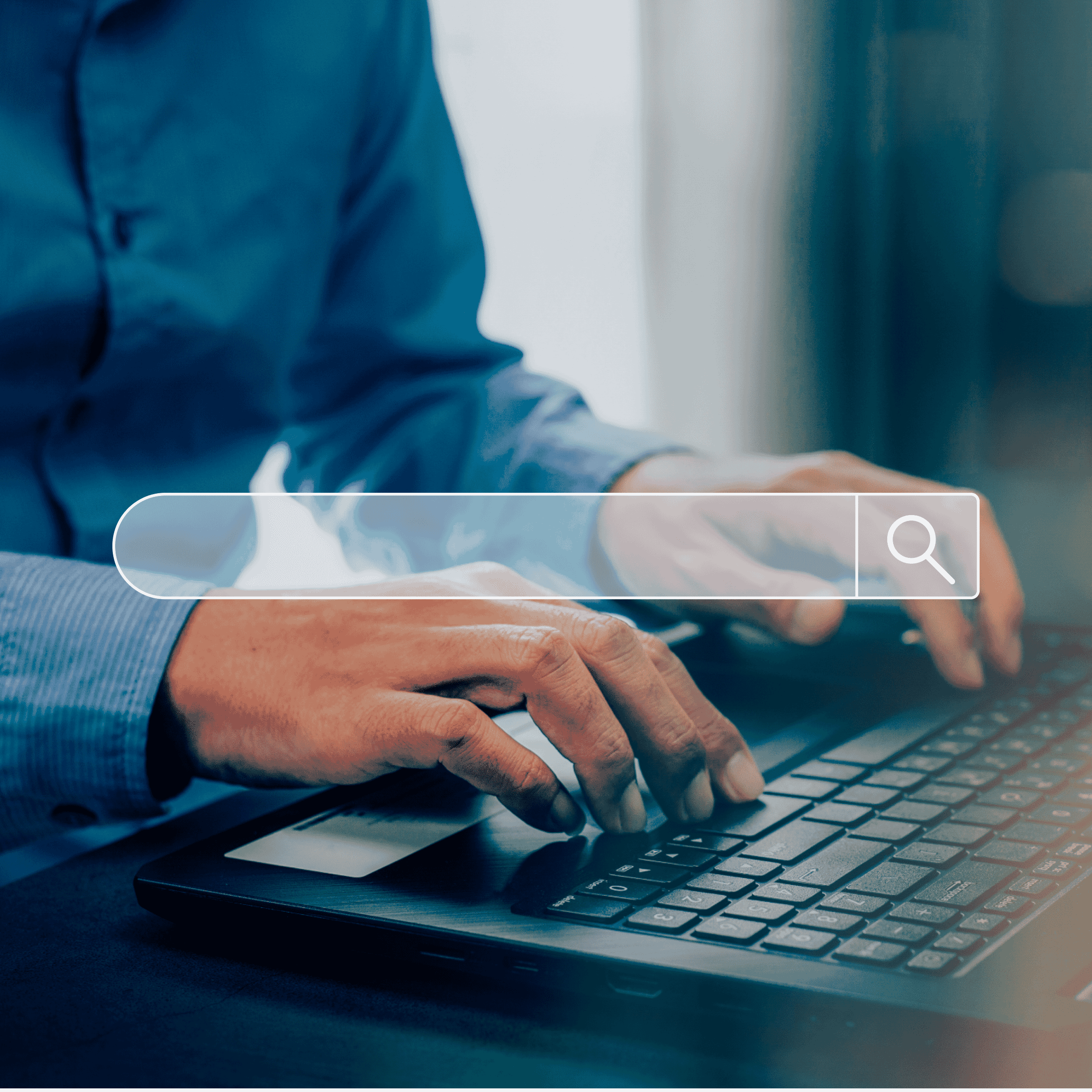 image of search bar imposed over a man's hands typing on a keyboard