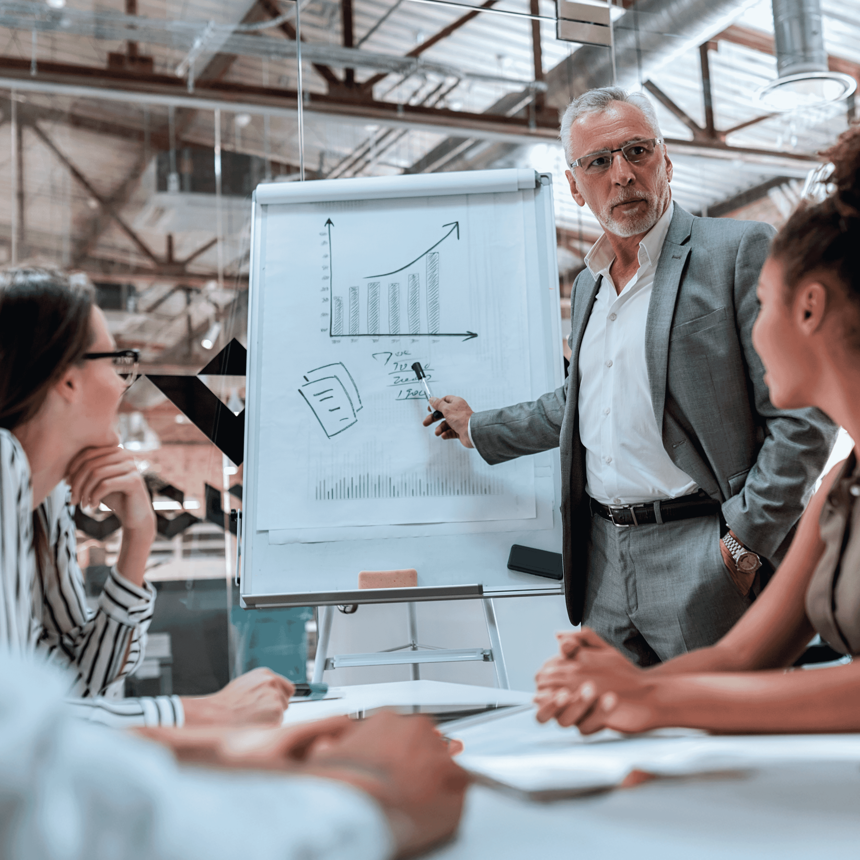 A confident, modern-looking team working around a shared digital workspace displaying clean content.