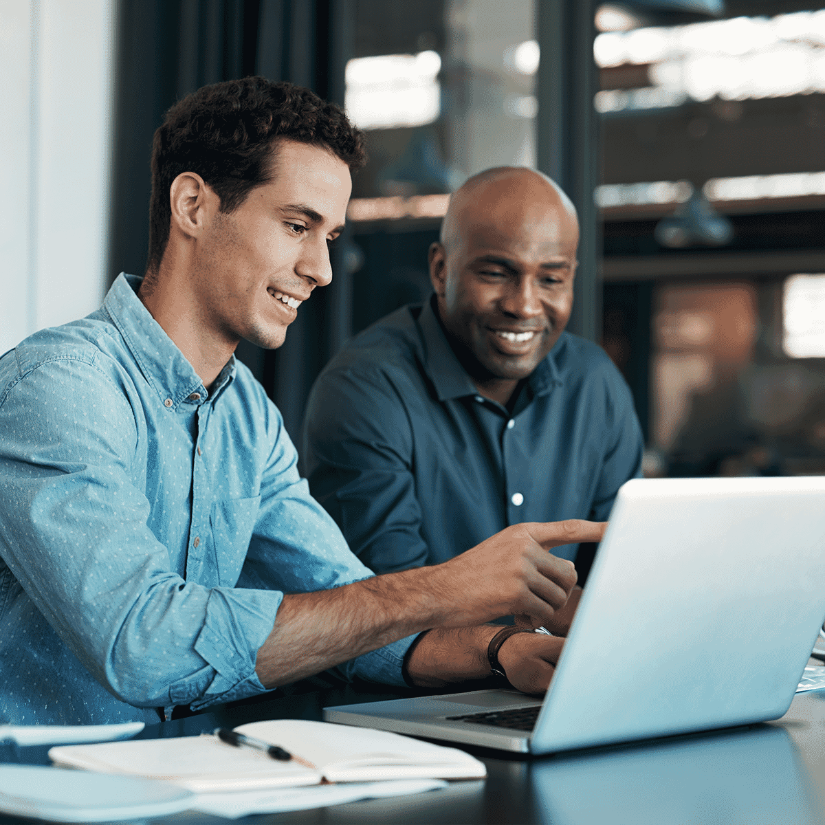 men working on laptop