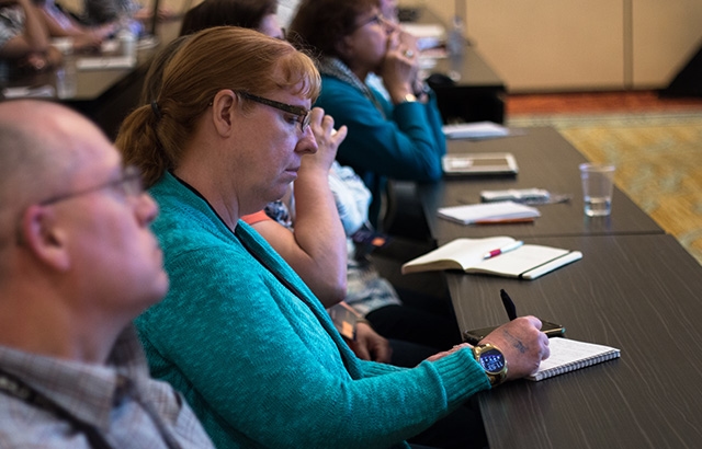 Photo of a person taking notes at MadWorld 2018