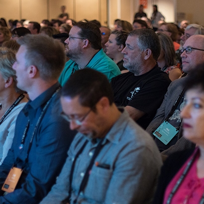 Photo of MadWorld Attendees listening in a conference