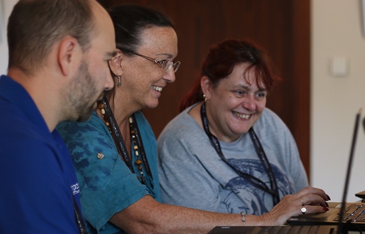 Photo of people working in the MadWorld 2018 lounge
