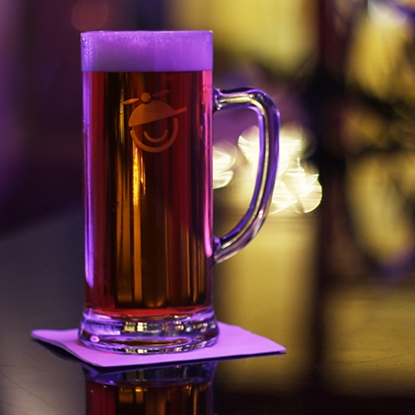 MadWorld Logo on a beer glass