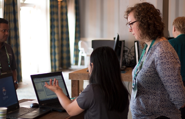 Support staff member assisting attendee