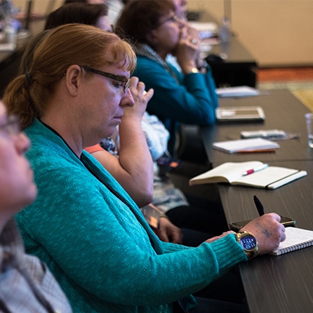 Photo of someone taking notes during a MadWorld session