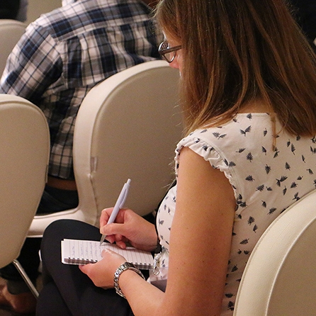 closeup of someone taking notes during a MadWorld session