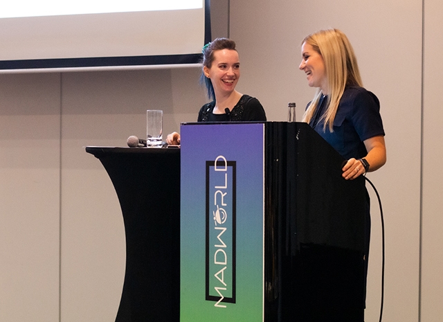 Photo of a MadWorld 2018 speaker smiling while presenting
