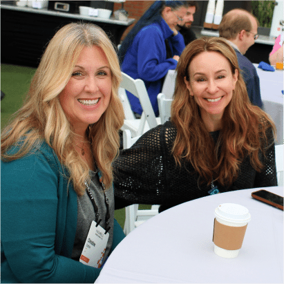 MadWorld 2023 attendees sitting at a table