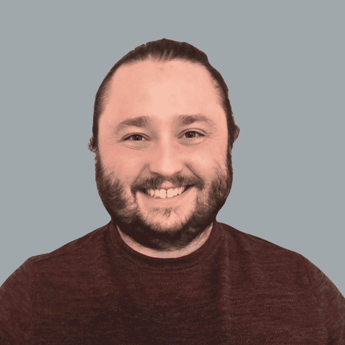 headshot of Logan Mazza with a maroon sweater