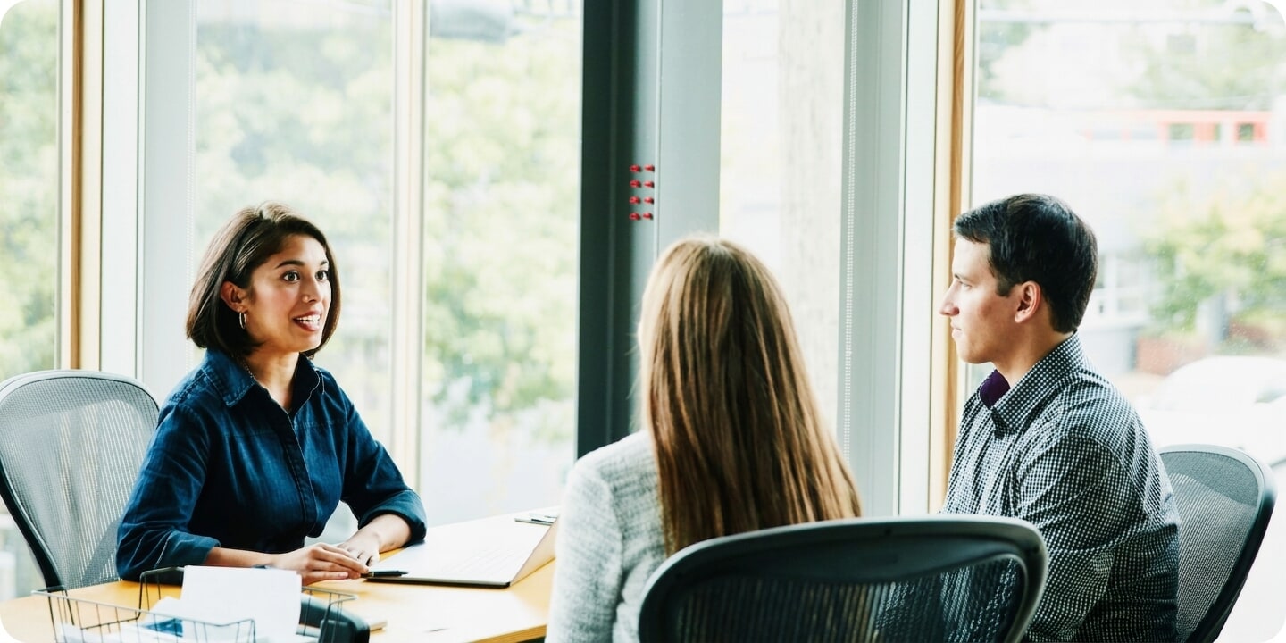 Women speaking at desk