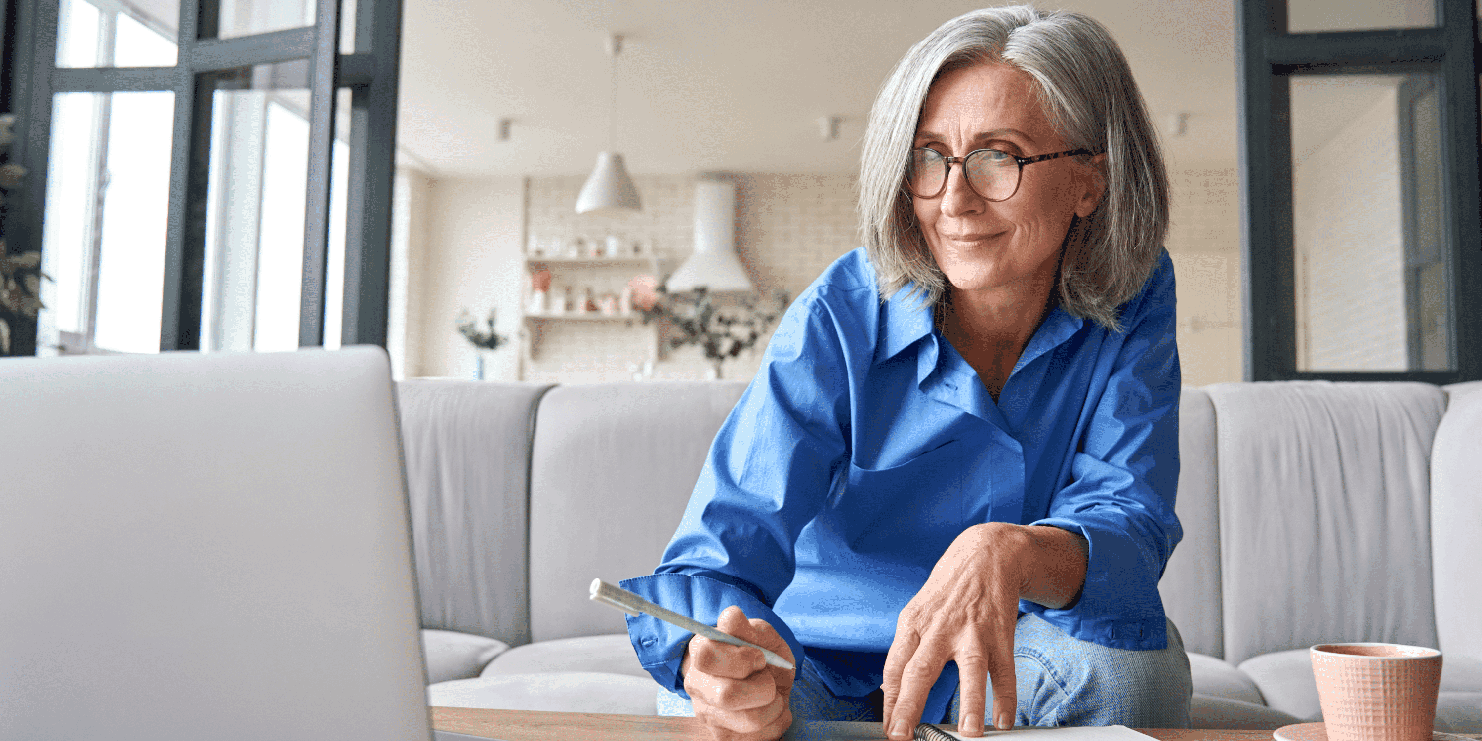 Photo of someone viewing a laptop