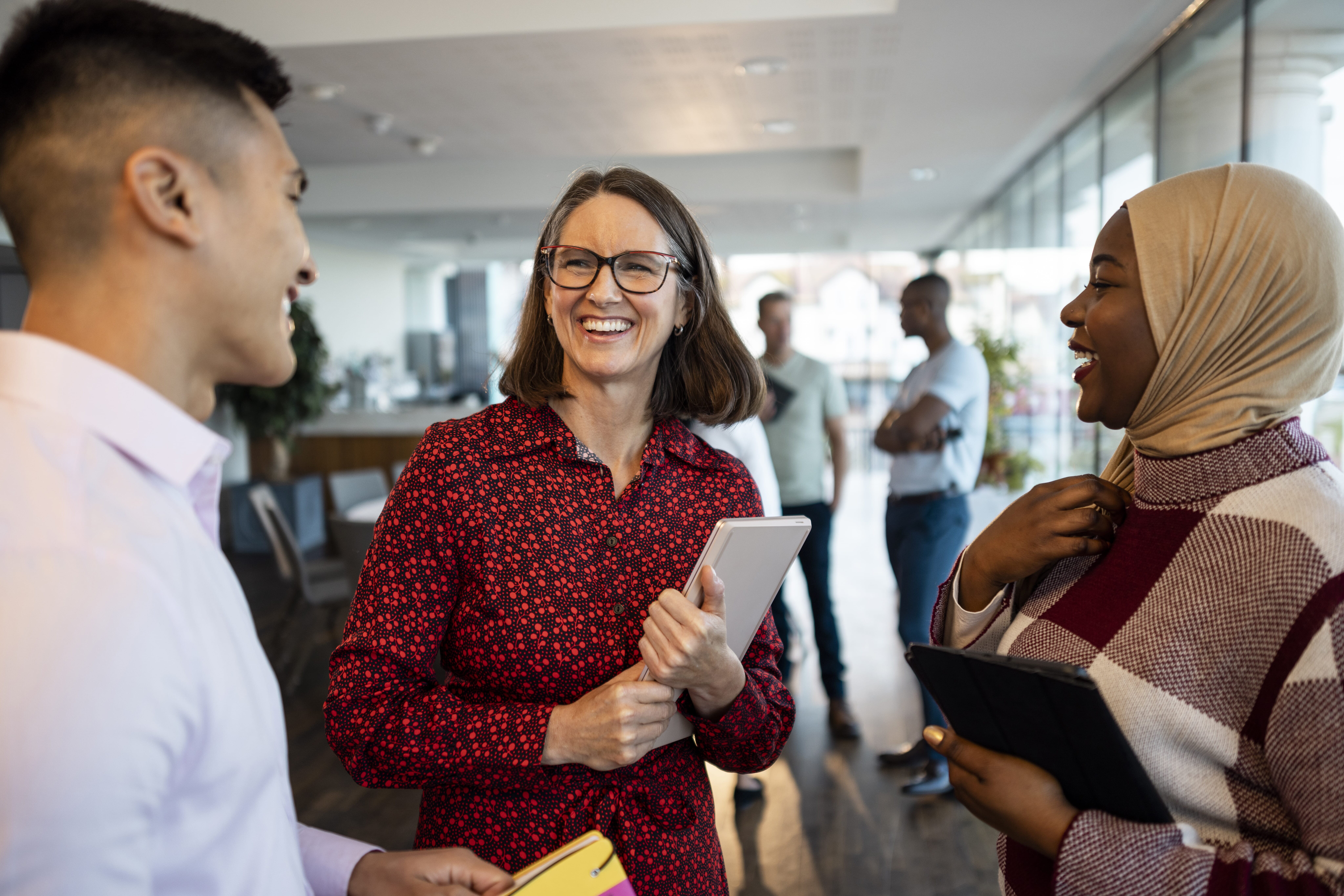 Image of people smiling and talking