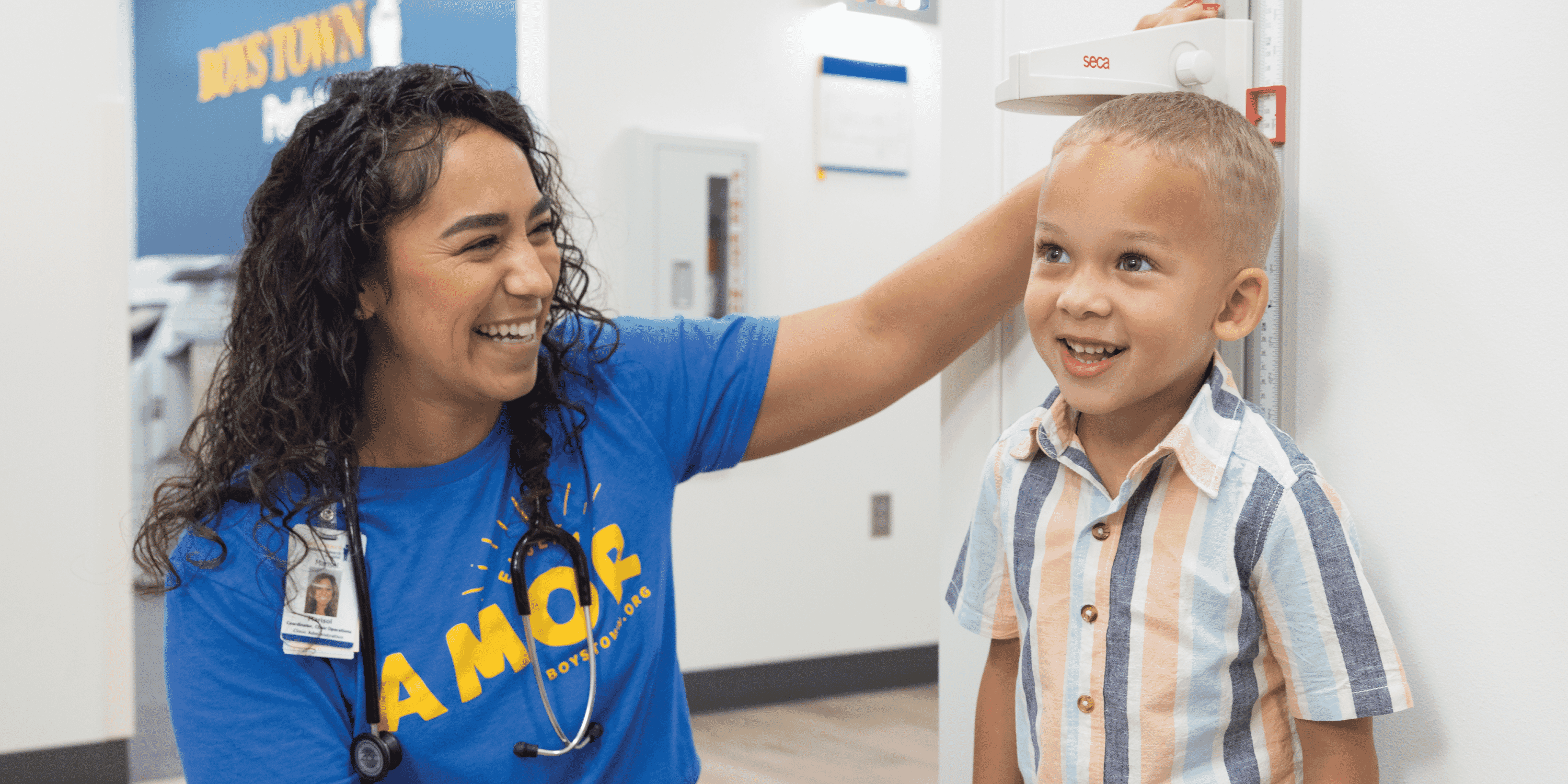 Photo of a nurse and a child smiling