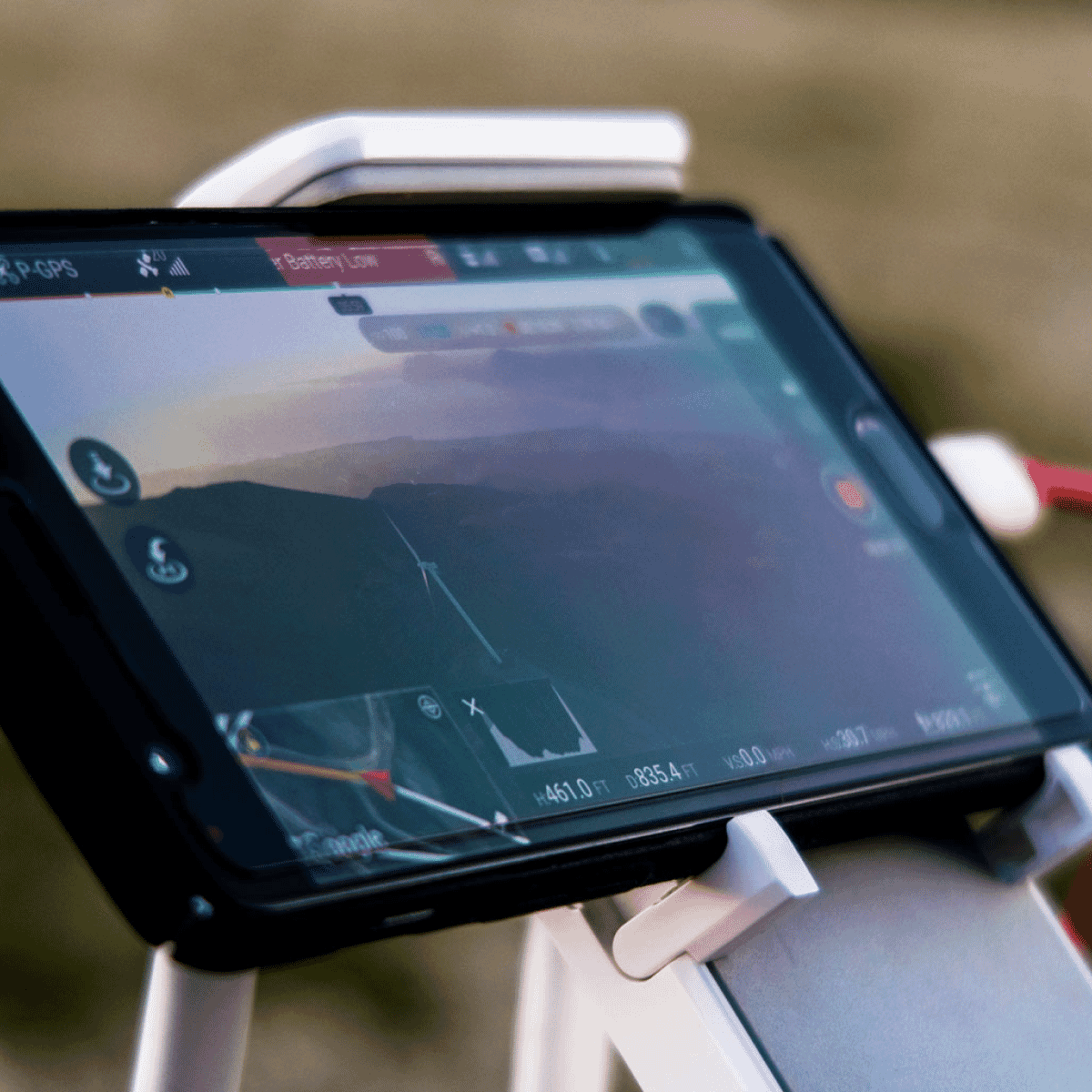 android phone playing video game in a white holder