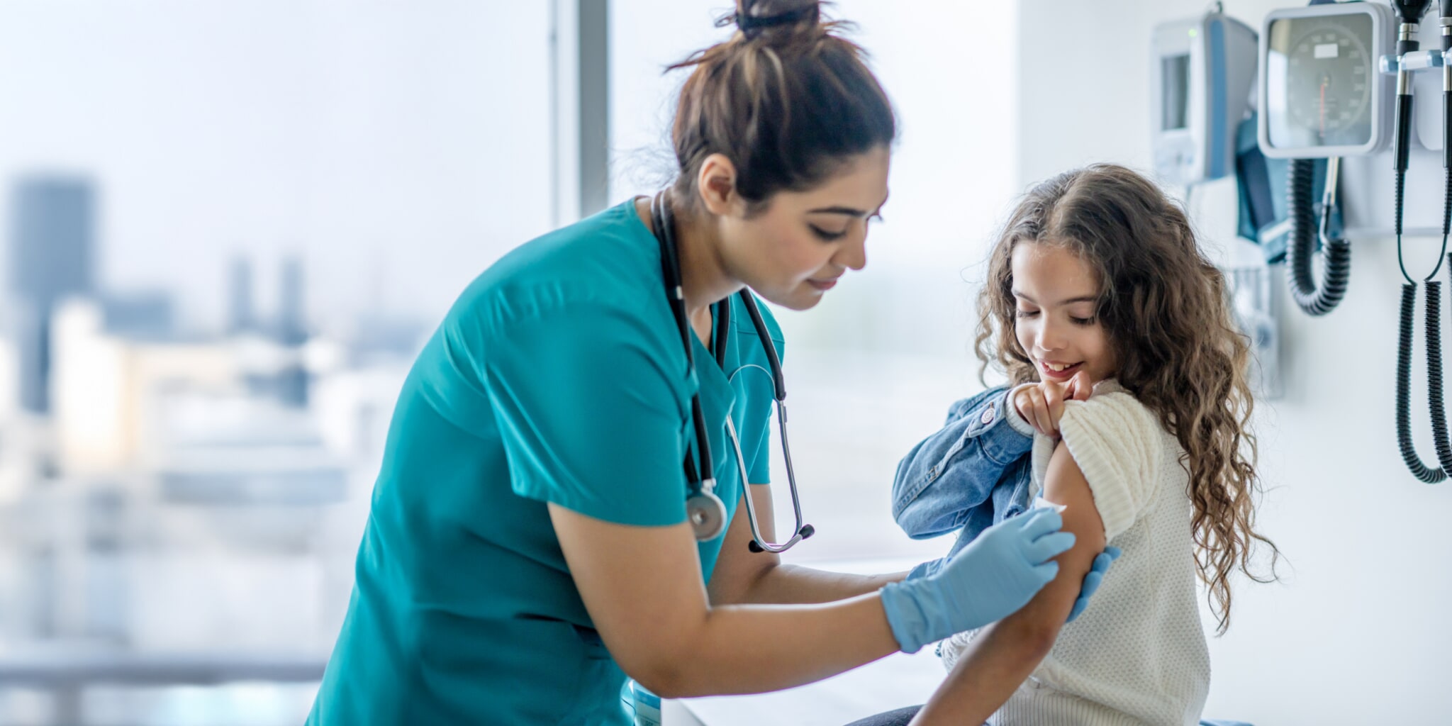 image of a nurse helping a young patient