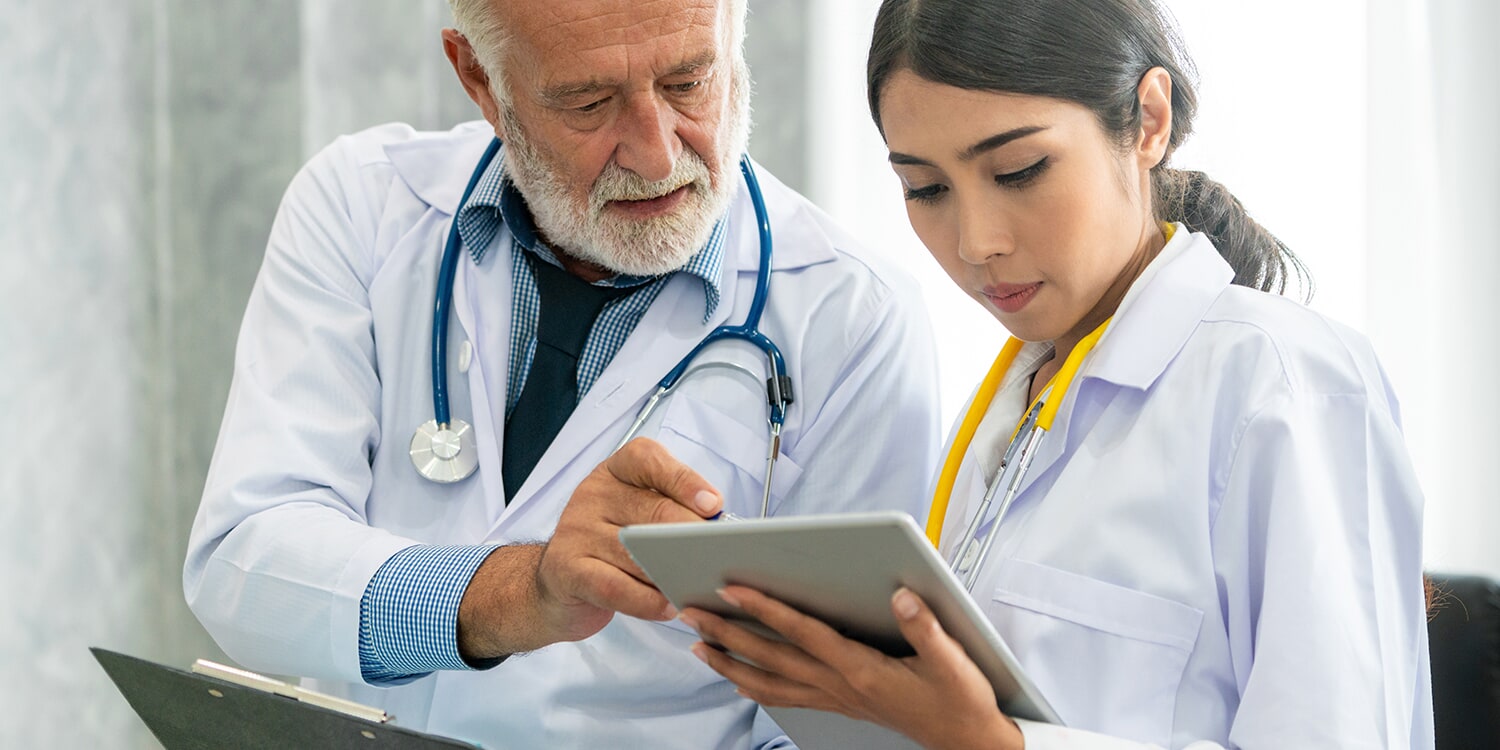 Medical staff looking at tablet