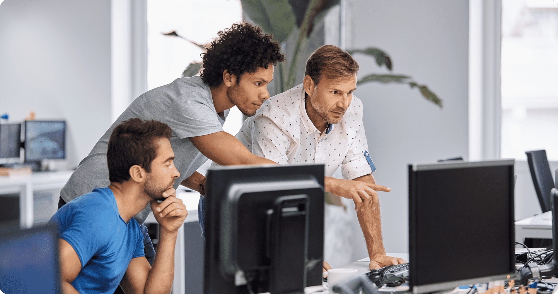Men working at computer