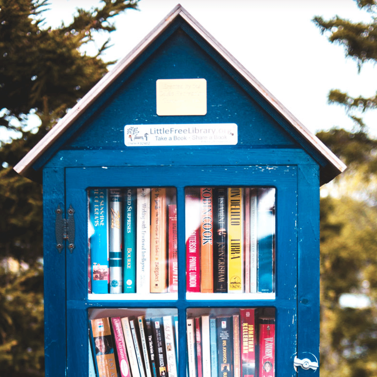 Out door community book cabinet filled with books