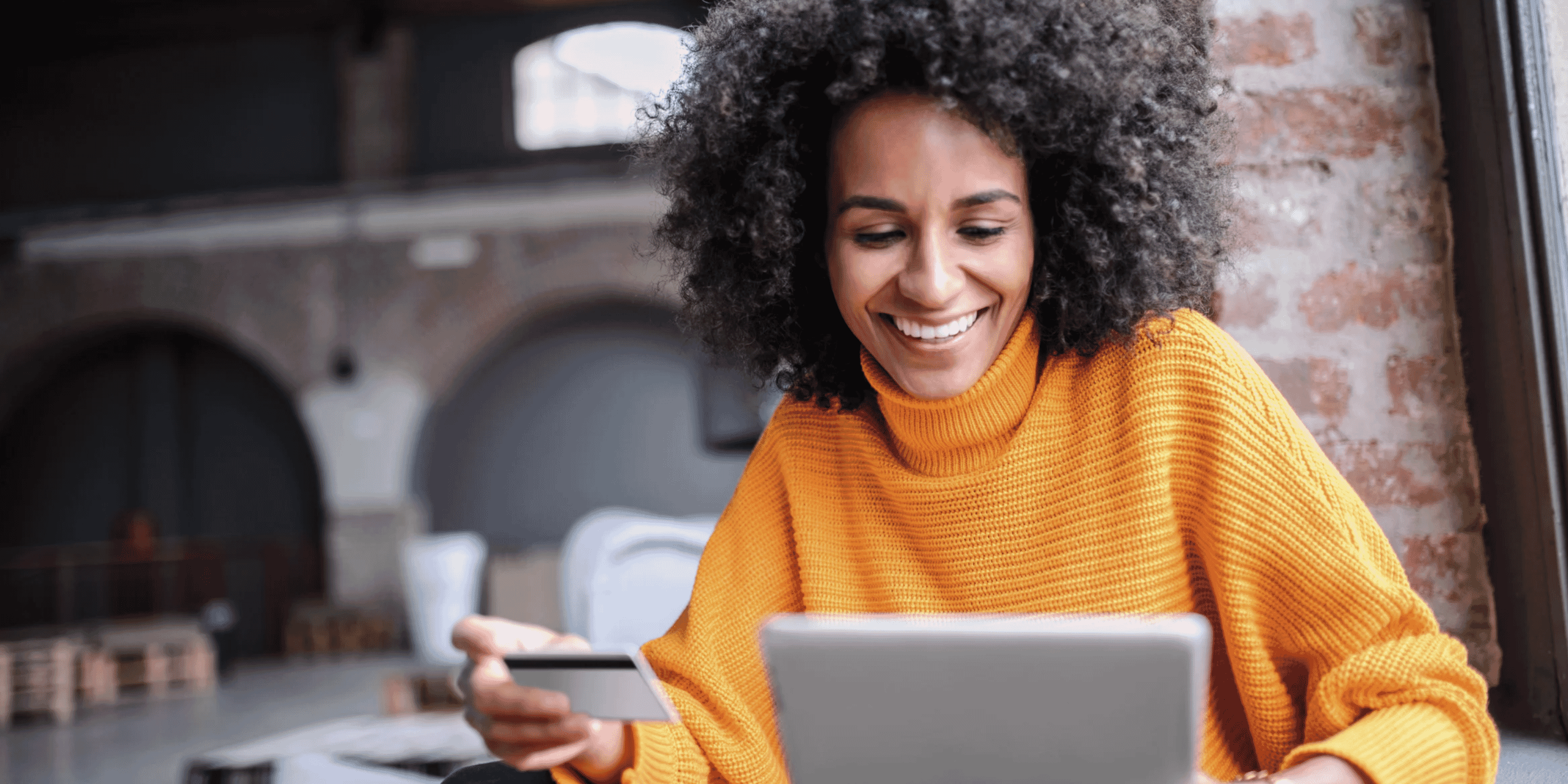woman with tablet and credit card